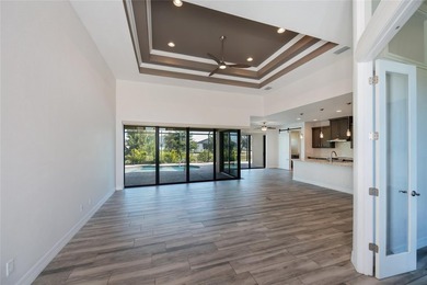 Exquisite 2021 custom-built DM Dean residence on a fully fenced on Rotonda Golf and Country Club The Palms Course in Florida - for sale on GolfHomes.com, golf home, golf lot