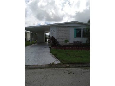 Beautiful cozy waterfront home in Village green Community.  This on Vista Plantation Golf Club in Florida - for sale on GolfHomes.com, golf home, golf lot
