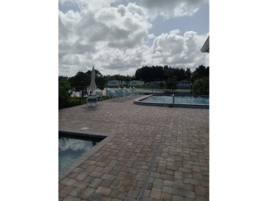 Beautiful cozy waterfront home in Village green Community.  This on Vista Plantation Golf Club in Florida - for sale on GolfHomes.com, golf home, golf lot