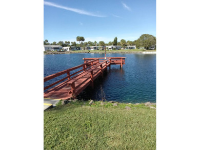 Beautiful cozy waterfront home in Village green Community.  This on Vista Plantation Golf Club in Florida - for sale on GolfHomes.com, golf home, golf lot