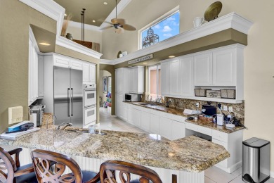 Golf course vistas fill this elegant custom 2-story 6 BD/5 BA on Woodfield Country Club in Florida - for sale on GolfHomes.com, golf home, golf lot