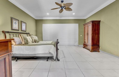 Golf course vistas fill this elegant custom 2-story 6 BD/5 BA on Woodfield Country Club in Florida - for sale on GolfHomes.com, golf home, golf lot