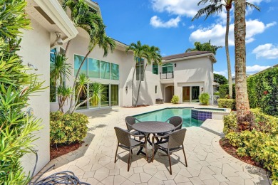 Golf course vistas fill this elegant custom 2-story 6 BD/5 BA on Woodfield Country Club in Florida - for sale on GolfHomes.com, golf home, golf lot