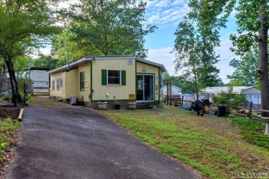 Cozy and character-filled nestled in a quiet lake community just on River Ridge Golf Club in Virginia - for sale on GolfHomes.com, golf home, golf lot