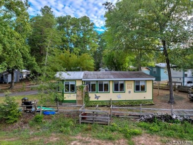 Cozy and character-filled nestled in a quiet lake community just on River Ridge Golf Club in Virginia - for sale on GolfHomes.com, golf home, golf lot