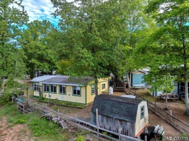 Cozy and character-filled nestled in a quiet lake community just on River Ridge Golf Club in Virginia - for sale on GolfHomes.com, golf home, golf lot