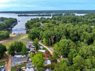 Cozy and character-filled nestled in a quiet lake community just on River Ridge Golf Club in Virginia - for sale on GolfHomes.com, golf home, golf lot