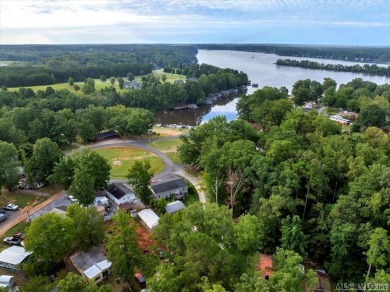 Cozy and character-filled nestled in a quiet lake community just on River Ridge Golf Club in Virginia - for sale on GolfHomes.com, golf home, golf lot