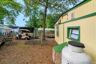 Cozy and character-filled nestled in a quiet lake community just on River Ridge Golf Club in Virginia - for sale on GolfHomes.com, golf home, golf lot