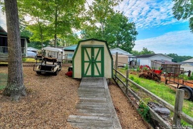 Cozy and character-filled nestled in a quiet lake community just on River Ridge Golf Club in Virginia - for sale on GolfHomes.com, golf home, golf lot