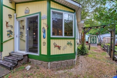 Cozy and character-filled nestled in a quiet lake community just on River Ridge Golf Club in Virginia - for sale on GolfHomes.com, golf home, golf lot