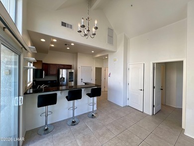 Enjoy golf course living in this second-floor condo overlooking on London Bridge Golf Course in Arizona - for sale on GolfHomes.com, golf home, golf lot