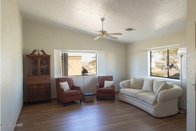 Welcome to this beautifully maintained 1,630 sq ft 2 bed, 2 bath on London Bridge Golf Course in Arizona - for sale on GolfHomes.com, golf home, golf lot