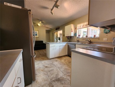 BEAUTIFUL LAKE VIEWS AND FLORIDA CHARM!This wonderful home on Duffys Golf Center in Florida - for sale on GolfHomes.com, golf home, golf lot