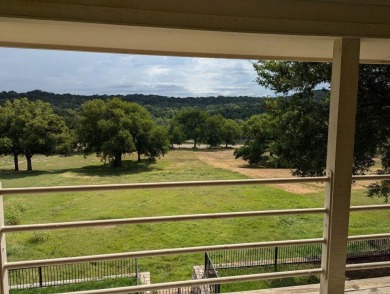 Stately 2 story limestone home on almost 2 sloping acres to the on Pecan Plantation Country Club in Texas - for sale on GolfHomes.com, golf home, golf lot