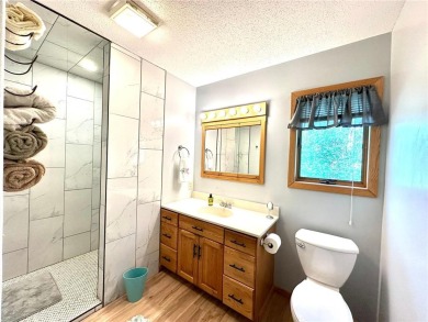 This impressive 3-bedroom, 2-bathroom home proudly overlooks the on Headwaters Country Club in Minnesota - for sale on GolfHomes.com, golf home, golf lot