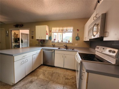 BEAUTIFUL LAKE VIEWS AND FLORIDA CHARM!This wonderful home on Duffys Golf Center in Florida - for sale on GolfHomes.com, golf home, golf lot