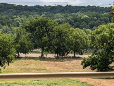 Stately 2 story limestone home on almost 2 sloping acres to the on Pecan Plantation Country Club in Texas - for sale on GolfHomes.com, golf home, golf lot