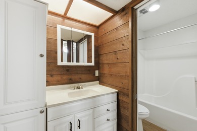 Overlook a golf course/pond in this ultra contemporary condo // on Hilaman Park Golf Course in Florida - for sale on GolfHomes.com, golf home, golf lot