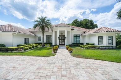 Experience luxury living in this stunning, modern estate on Isleworth Golf and Country Club in Florida - for sale on GolfHomes.com, golf home, golf lot