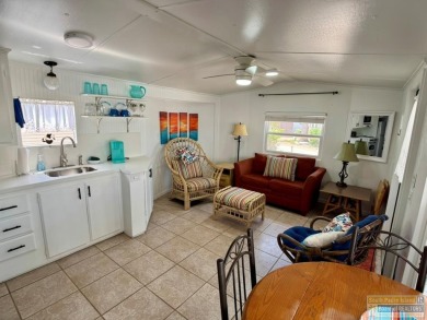 Cute and nicely updated park model featuring large full length on Long Island Golf Course in Texas - for sale on GolfHomes.com, golf home, golf lot