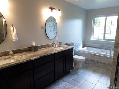 Sought after Waterstone Sub. 15 lakes and golf course community on Boulder Pointe Golf Club and Conference Center in Michigan - for sale on GolfHomes.com, golf home, golf lot