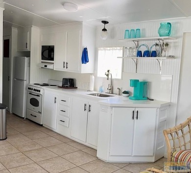 Cute and nicely updated park model featuring large full length on Long Island Golf Course in Texas - for sale on GolfHomes.com, golf home, golf lot
