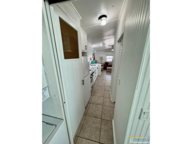 Cute and nicely updated park model featuring large full length on Long Island Golf Course in Texas - for sale on GolfHomes.com, golf home, golf lot