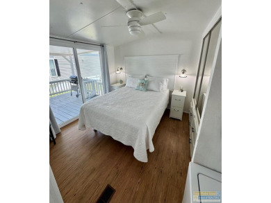 Cute and nicely updated park model featuring large full length on Long Island Golf Course in Texas - for sale on GolfHomes.com, golf home, golf lot