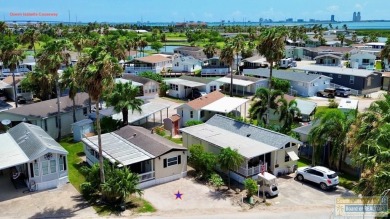 Cute and nicely updated park model featuring large full length on Long Island Golf Course in Texas - for sale on GolfHomes.com, golf home, golf lot