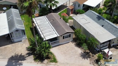 Cute and nicely updated park model featuring large full length on Long Island Golf Course in Texas - for sale on GolfHomes.com, golf home, golf lot