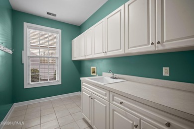 Spacious 5-bedroom, 3.5-bath home in the desirable gated Island on Island West Golf Club in South Carolina - for sale on GolfHomes.com, golf home, golf lot