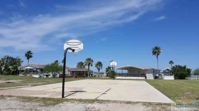 Cute and nicely updated park model featuring large full length on Long Island Golf Course in Texas - for sale on GolfHomes.com, golf home, golf lot