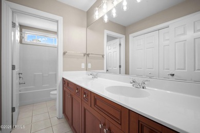 Spacious 5-bedroom, 3.5-bath home in the desirable gated Island on Island West Golf Club in South Carolina - for sale on GolfHomes.com, golf home, golf lot