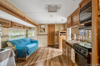 Enjoy the perfect blend of comfort and recreation in this 2 bed on River Ridge Golf Club in Virginia - for sale on GolfHomes.com, golf home, golf lot