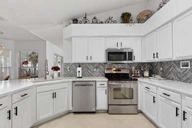 Welcome to this beautifully updated, move-in ready home located on Tampa Bay Golf and Country Club in Florida - for sale on GolfHomes.com, golf home, golf lot