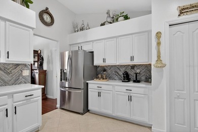 Welcome to this beautifully updated, move-in ready home located on Tampa Bay Golf and Country Club in Florida - for sale on GolfHomes.com, golf home, golf lot