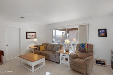 Elevate your lifestyle with sweeping water views and a front-row on London Bridge Golf Course in Arizona - for sale on GolfHomes.com, golf home, golf lot