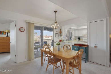 Elevate your lifestyle with sweeping water views and a front-row on London Bridge Golf Course in Arizona - for sale on GolfHomes.com, golf home, golf lot