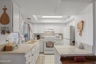 Elevate your lifestyle with sweeping water views and a front-row on London Bridge Golf Course in Arizona - for sale on GolfHomes.com, golf home, golf lot