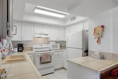 Elevate your lifestyle with sweeping water views and a front-row on London Bridge Golf Course in Arizona - for sale on GolfHomes.com, golf home, golf lot