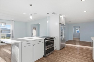 Exquisite Waterfront Oasis - Discover coastal luxury at its on Palm Harbor Golf Club in Florida - for sale on GolfHomes.com, golf home, golf lot