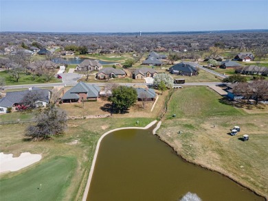 GOLFER'S DREAM HOME overlooking 17th green and pond in Pecan on Pecan Plantation Country Club in Texas - for sale on GolfHomes.com, golf home, golf lot