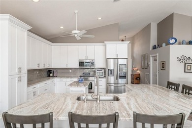 Ballantrae Pool Home with NEW ROOF, custom kitchen, new flooring on Santa Lucia River Club in Florida - for sale on GolfHomes.com, golf home, golf lot