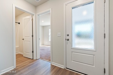 Step into this move-in ready 3 bedroom, 2 bath home built in on Lennon Hills Golf Course in North Carolina - for sale on GolfHomes.com, golf home, golf lot