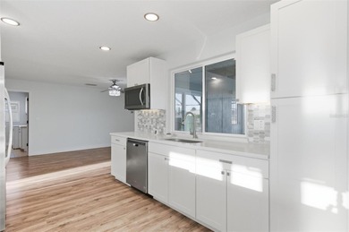 Exquisite Waterfront Oasis - Discover coastal luxury at its on Palm Harbor Golf Club in Florida - for sale on GolfHomes.com, golf home, golf lot