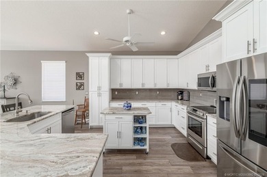 Ballantrae Pool Home with NEW ROOF, custom kitchen, new flooring on Santa Lucia River Club in Florida - for sale on GolfHomes.com, golf home, golf lot