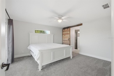 Exquisite Waterfront Oasis - Discover coastal luxury at its on Palm Harbor Golf Club in Florida - for sale on GolfHomes.com, golf home, golf lot