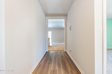 Step into this move-in ready 3 bedroom, 2 bath home built in on Lennon Hills Golf Course in North Carolina - for sale on GolfHomes.com, golf home, golf lot