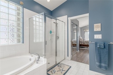 Ballantrae Pool Home with NEW ROOF, custom kitchen, new flooring on Santa Lucia River Club in Florida - for sale on GolfHomes.com, golf home, golf lot